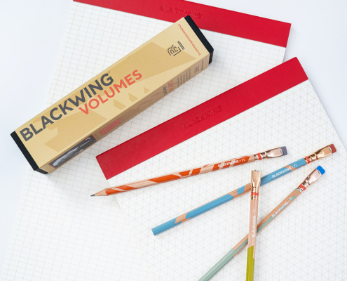 Photo of limited edition Frank Lloyd Wright pencils on top of a set of 2 legal pads.